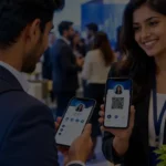 Professionals exchanging digital business cards on smartphones at a networking event.