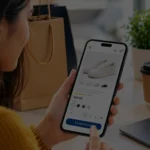 Woman shopping online on a smartphone using a mobile-friendly e-commerce website.