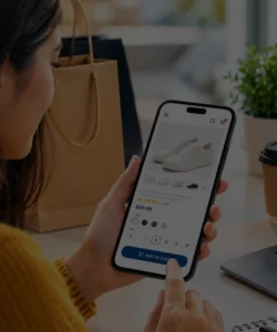 Woman shopping online on a smartphone using a mobile-friendly e-commerce website.